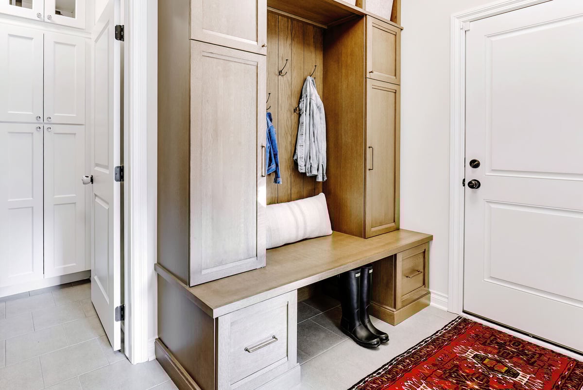 Custom mudroom with dual-tone cabinetry and built-in storage by Cabinet Creations in Oakland County, Michigan