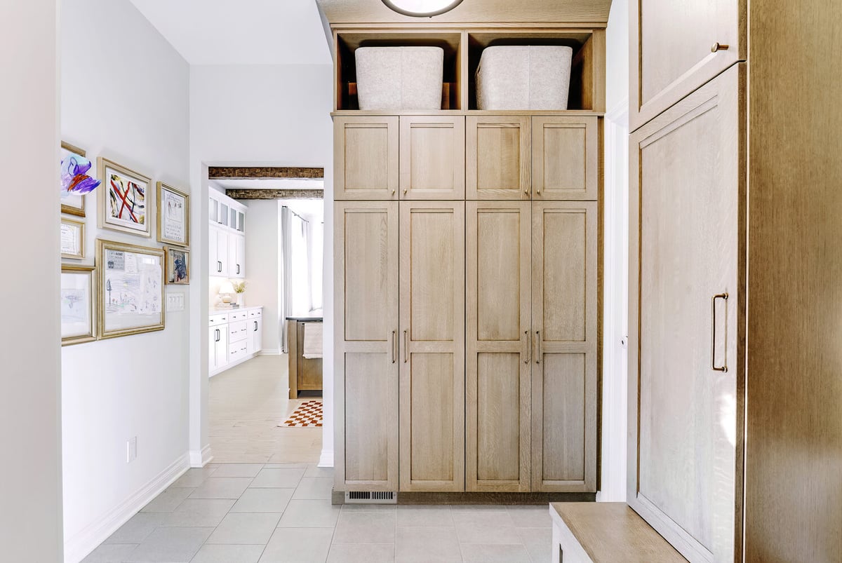 Floor-to-ceiling custom cabinetry in a mudroom entry by Cabinet Creations in Waterford Township, MI