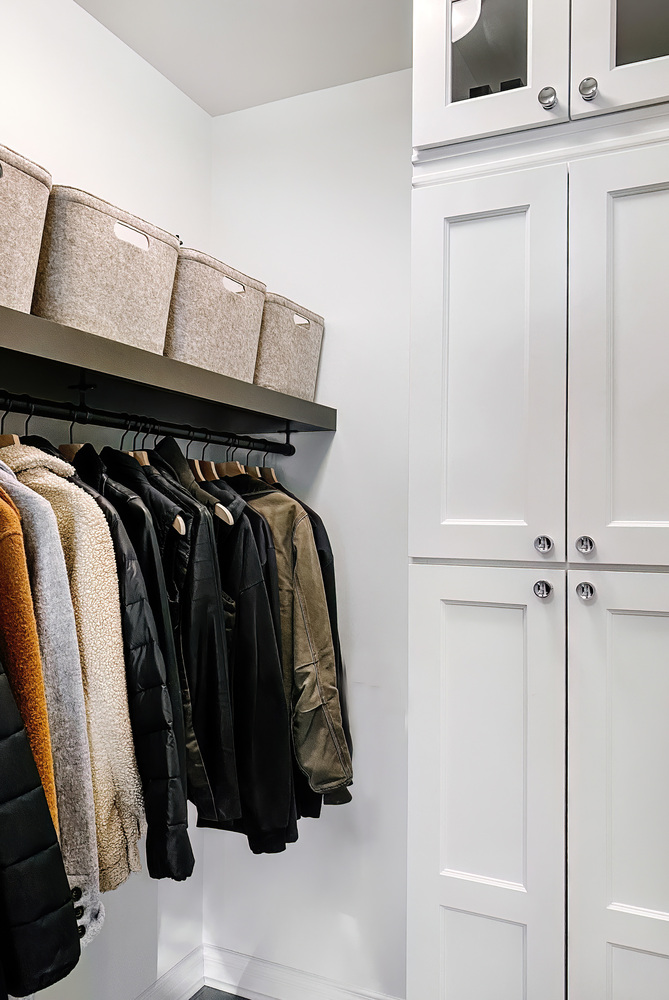 Smartly designed mudroom with built-in organization for coats and accessories in Waterford Township by Cabinet Creations