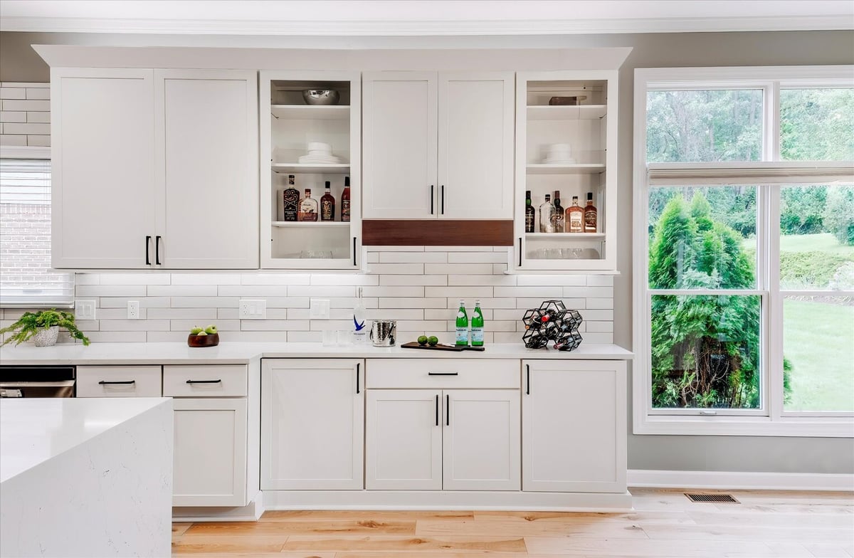 Custom kitchen bar with closed upper cabinets and white shaker design by Cabinet Creations in West Bloomfield, MI