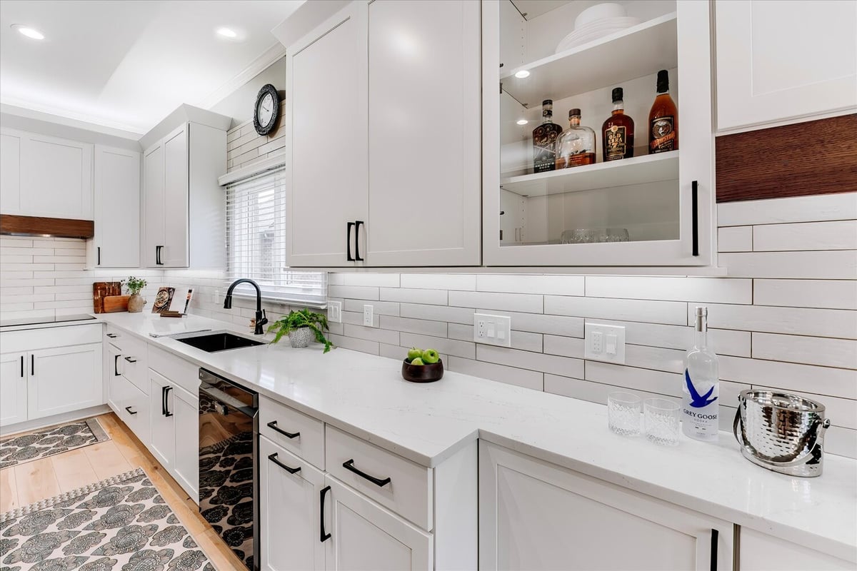 Luxury kitchen design with prep sink and under-cabinet lighting in Oakland County custom home