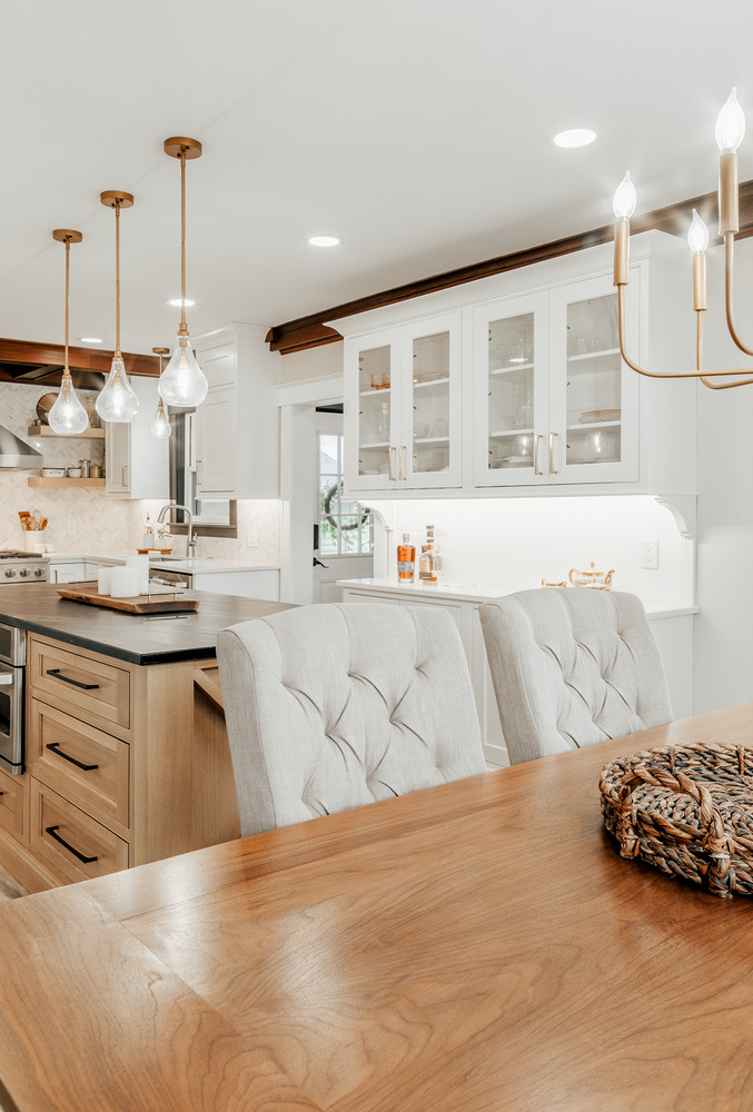 Bright dining and kitchen area with pendant lighting by Cabinet Creations in Lake Orion, MI