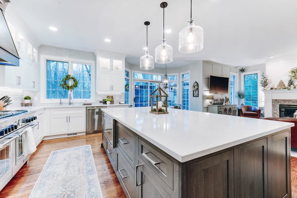 Bright custom kitchen with white cabinets and large island by Cabinet Creations in Oakland County, MI