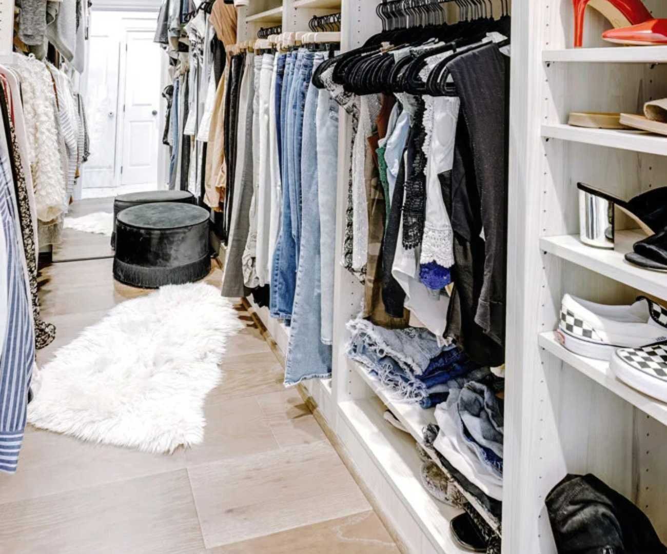 Cabinet Creations custom closet in Rochester, MI with built-in shelving, hanging storage, and wardrobe organizatio