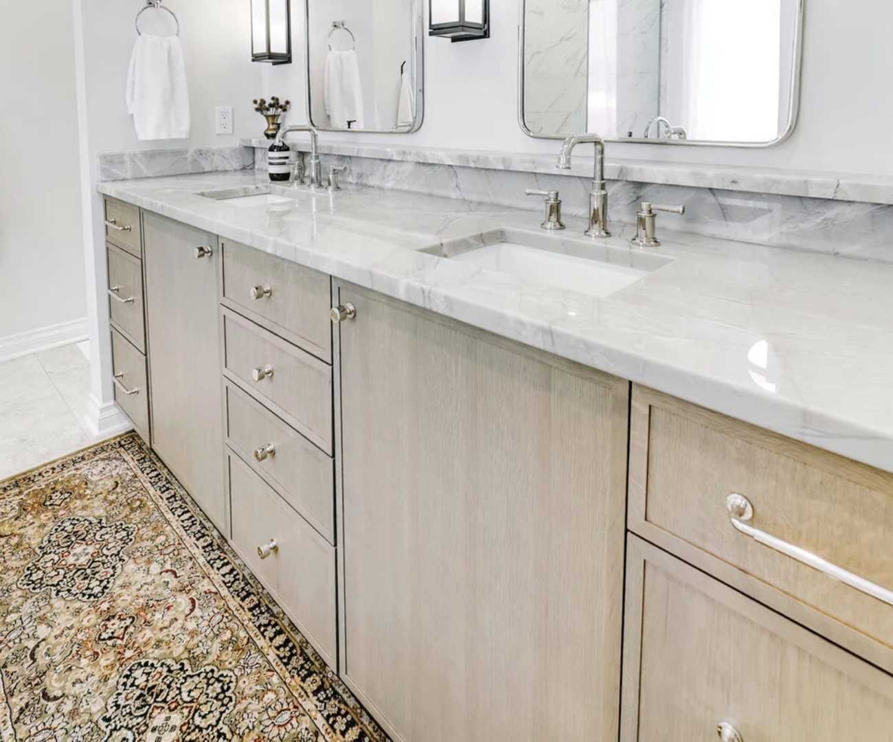 Custom bathroom vanity by Cabinet Creations in Rochester, MI with dual sinks, storage, and marble surfaces