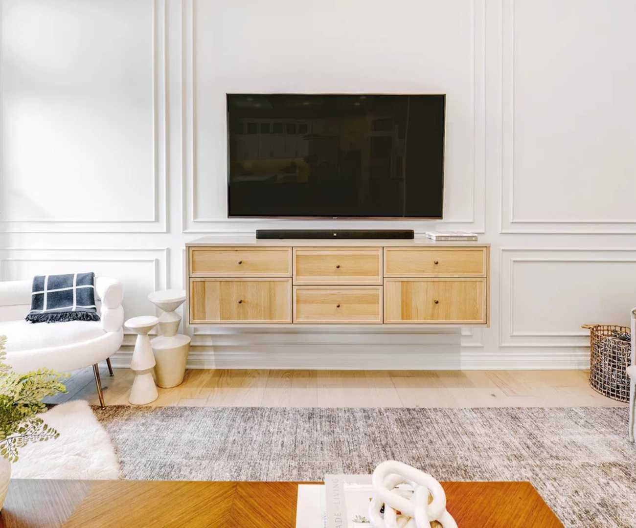 Custom living room entertainment center by Cabinet Creations in Rochester, MI with floating cabinetry and TV