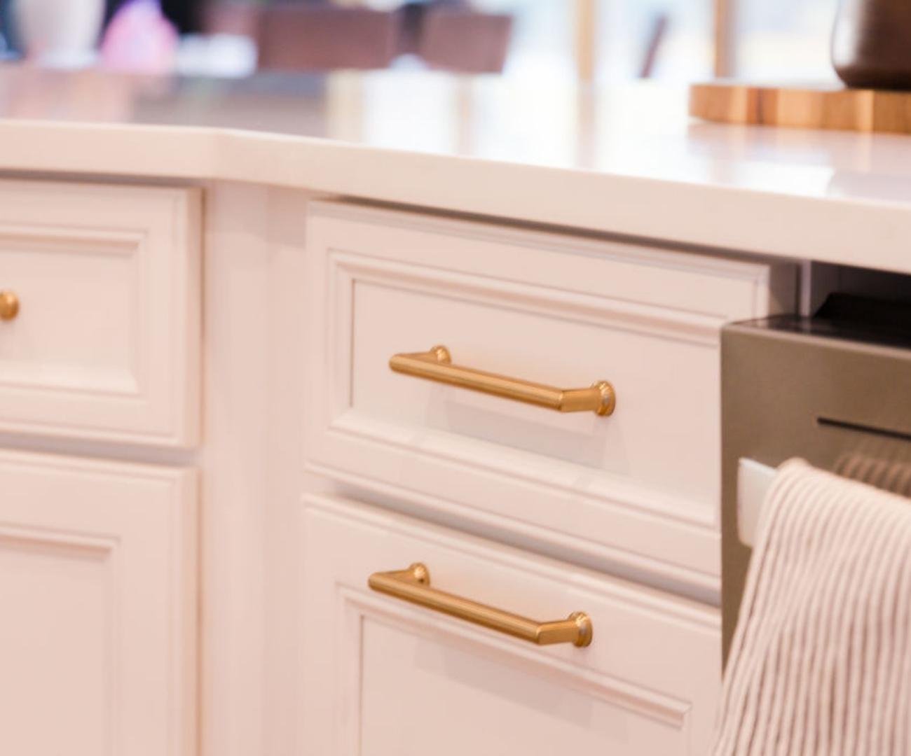 Image of a Cabinet Creations kitchen remodel with white cabinetry and warm brass hardware in West Bloomfield, MI Image of a Cabinet Creations kitchen remodel with white cabinetry and warm brass hardware in West Bloomfield, MI