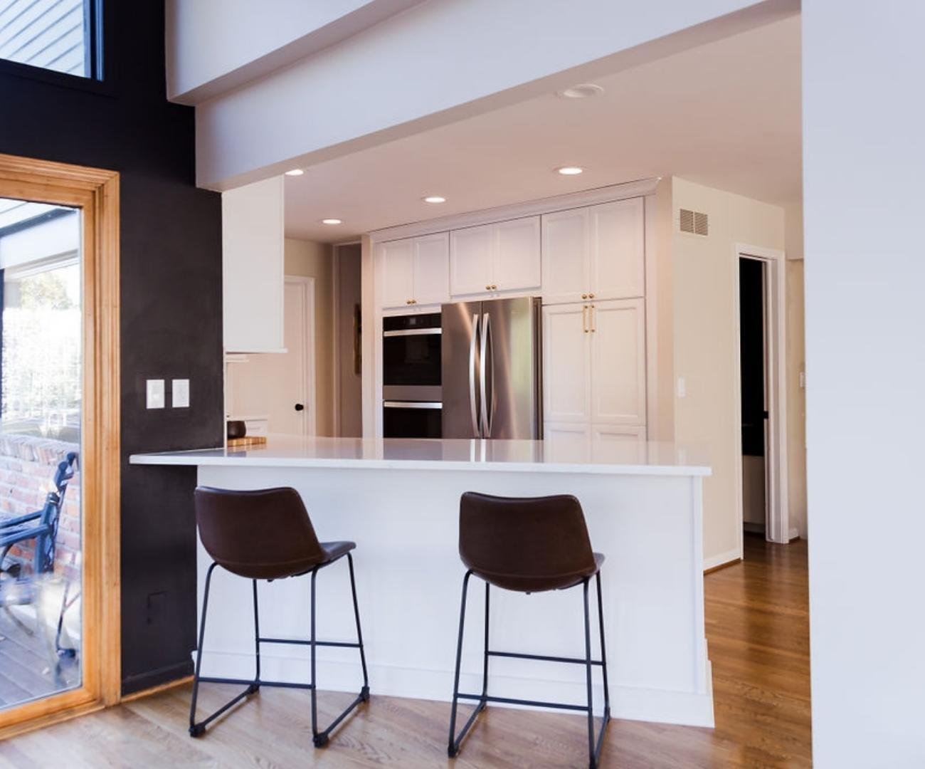 Image of bright kitchen remodel with custom cabinetry and island in West Bloomfield, MI by Cabinet Creations