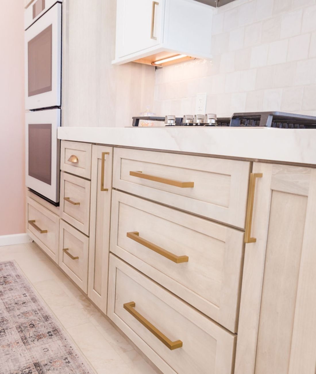Custom kitchen renovation with light wood drawers and gold hardware by Cabinet Creations in Oakland County, MI