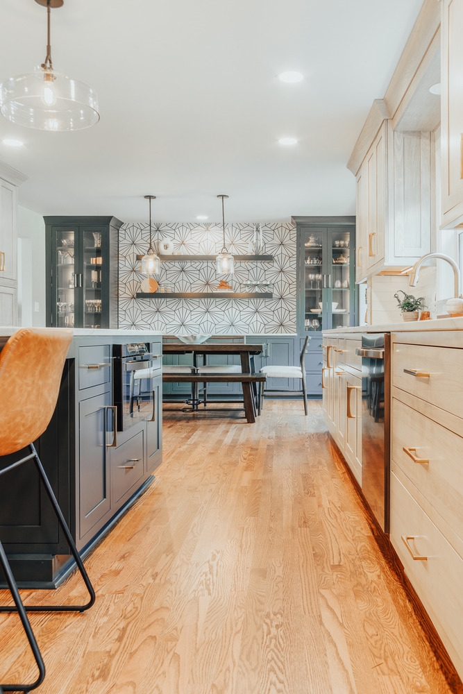 Clarkston custom kitchen by Cabinet Creations featuring a bright design with floating shelves and custom cabinetry
