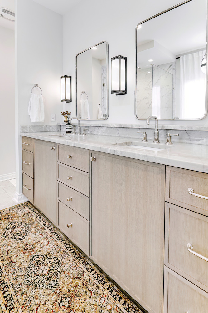Custom double-sink bathroom vanity with marble countertops by Cabinet Creations in Waterford Township, MI