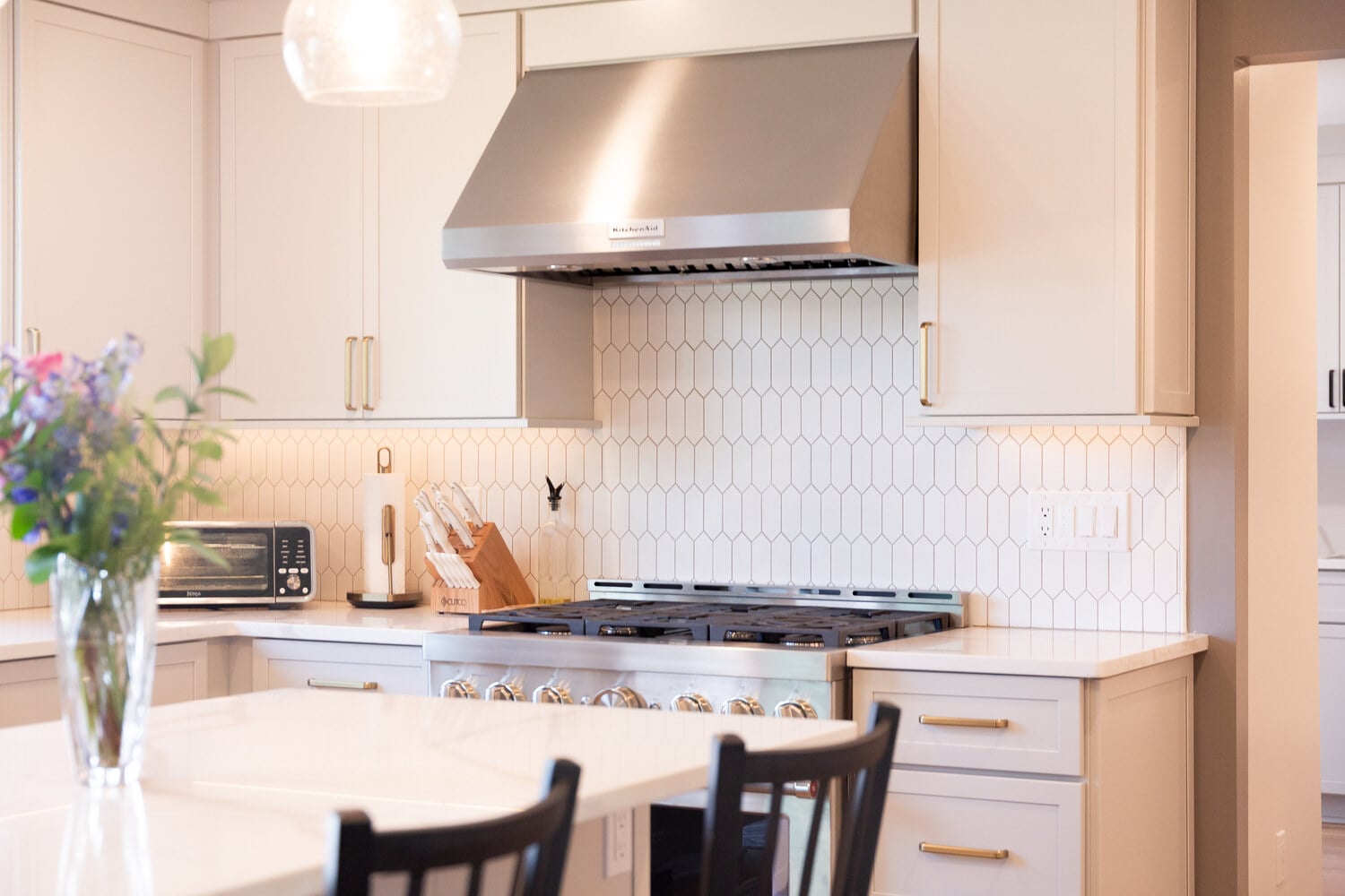 White shaker kitchen remodel with stainless appliances and elegant finishes by Cabinet Creations in Michigan