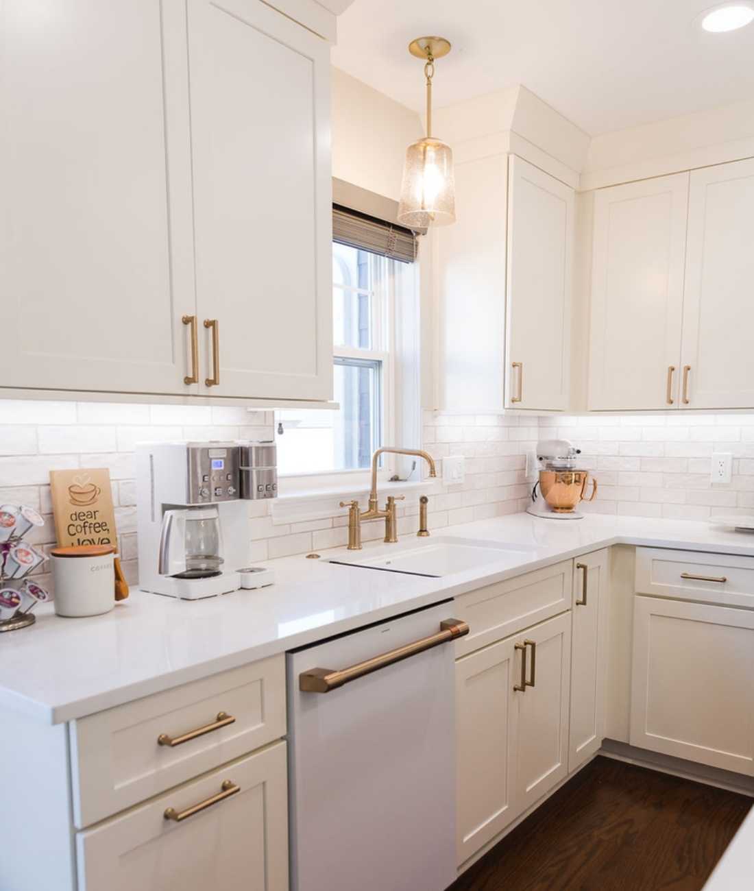 Bright white kitchen with modern finishes and luxury hardware by Cabinet Creations in Ferndale, MI