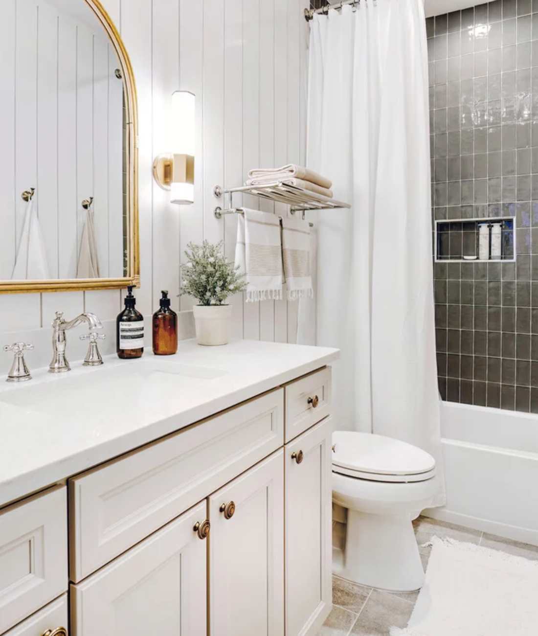 Cabinet Creations bathroom remodel in Rochester, MI featuring a custom vanity, tiled shower, and cla
