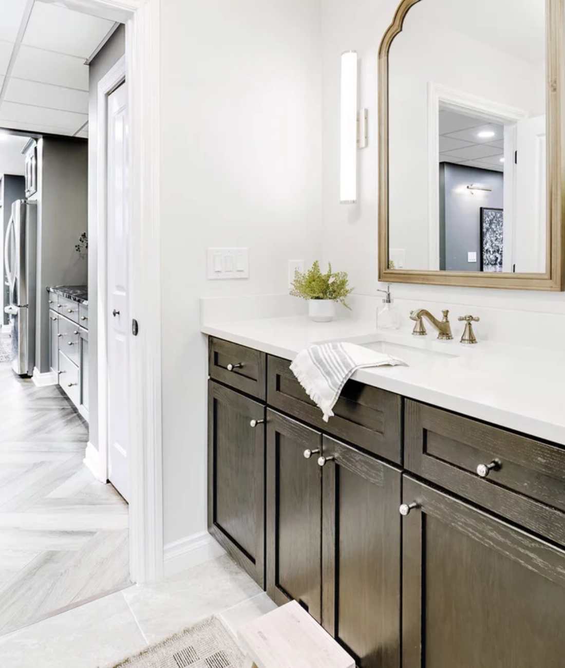 Custom bathroom remodel by Cabinet Creations in Rochester, MI with dark vanity cabinetry and modern