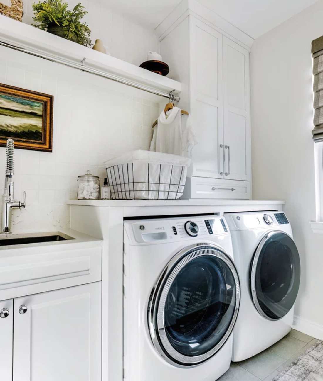 Custom laundry room remodel by Cabinet Creations in Rochester, MI with built-in storage and utility