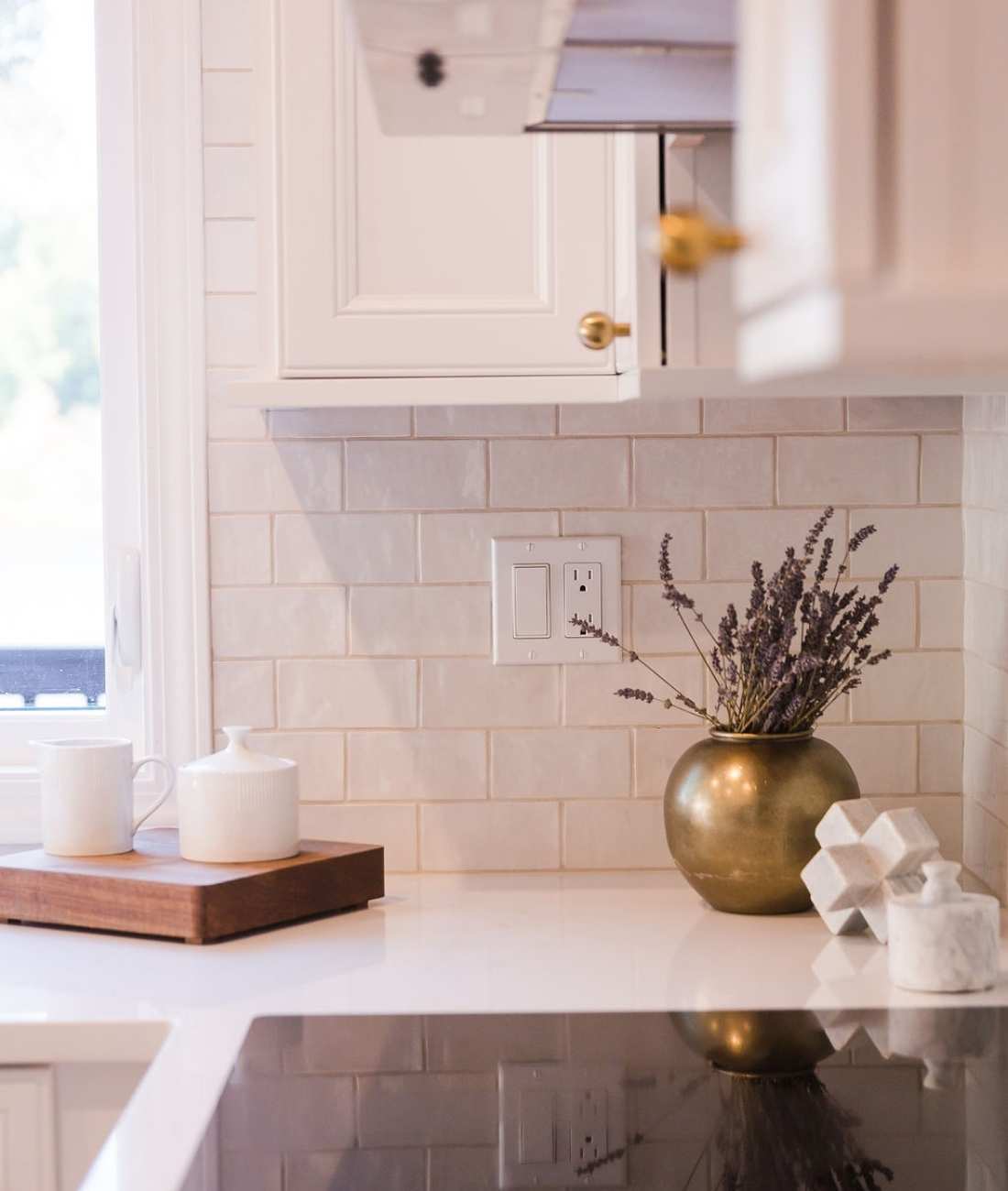 Image of custom kitchen backsplash with brass accents in West Bloomfield, MI by Cabinet Creations