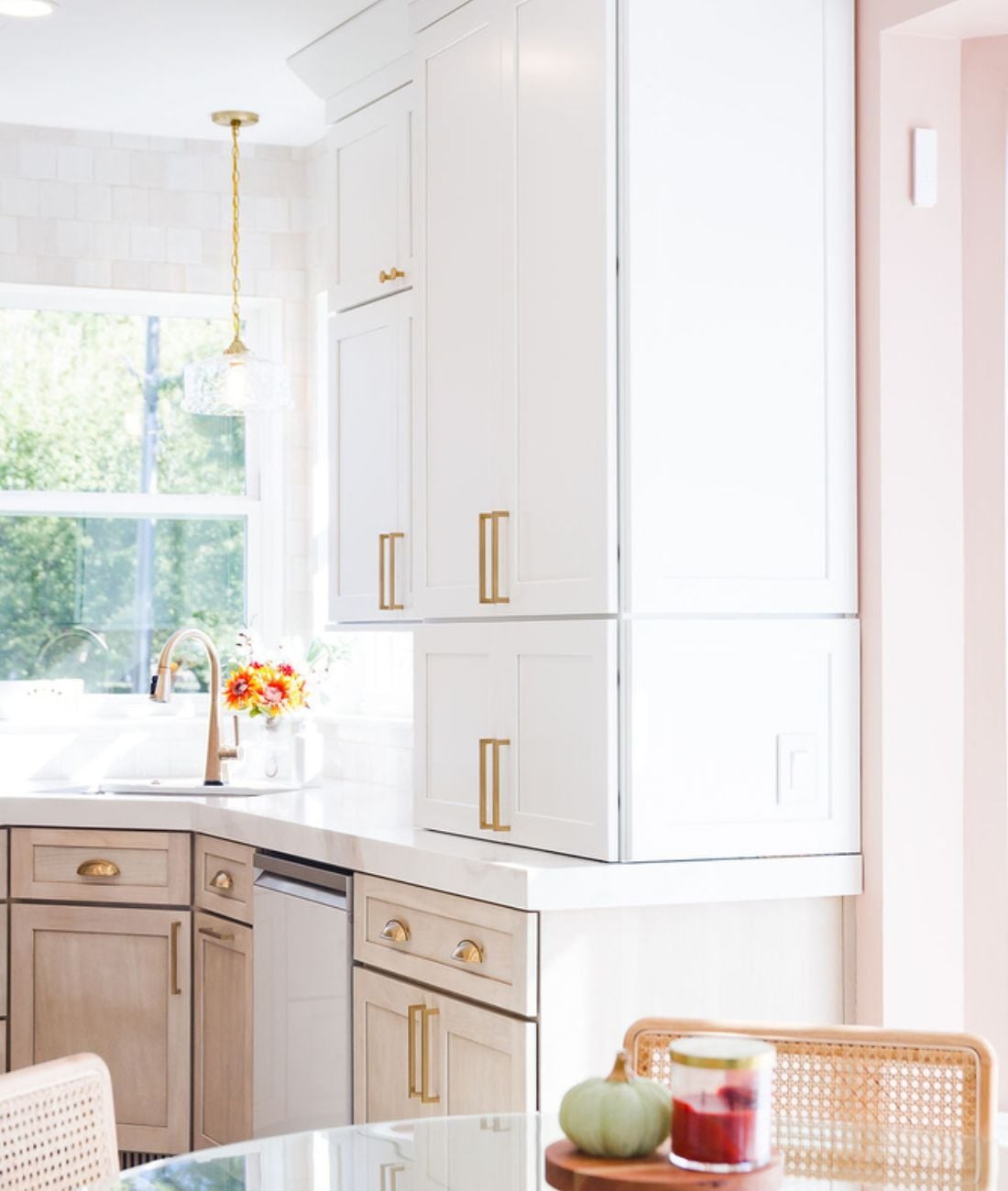 Elegant custom kitchen featuring tall white cabinets and gold handles by Cabinet Creations in Oakland County, Michigan